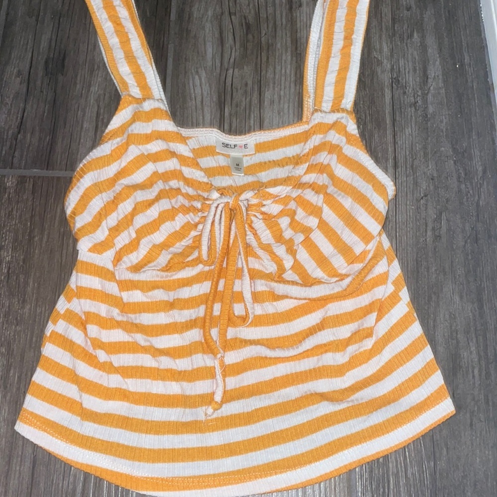 a cute crop top that ties in the middle and it’s pretty soft
